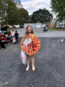 Girl dressed as a waffle at Trunk or Treat